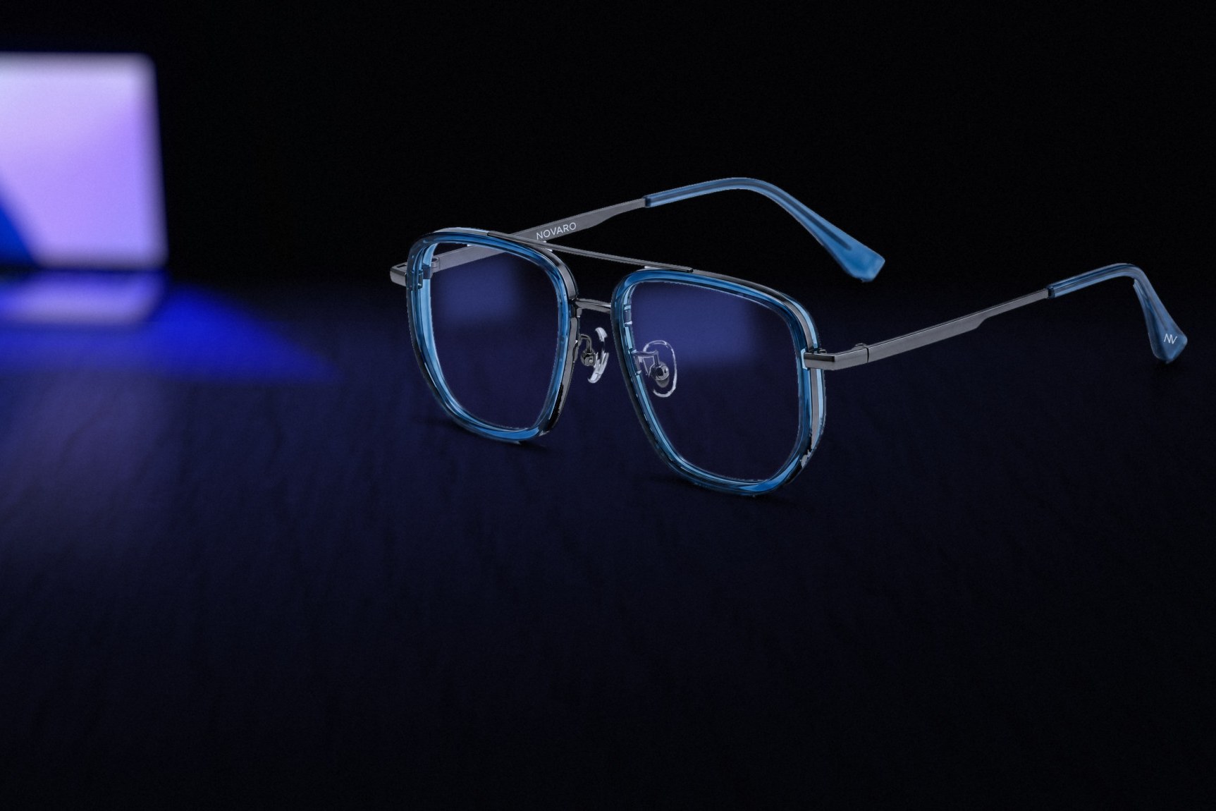 NOVARO Blue frames with blue-light lenses beside a laptop screen